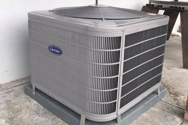 Air conditioner beside a home
