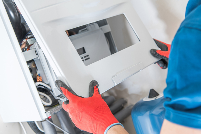 Technician servicing central heating